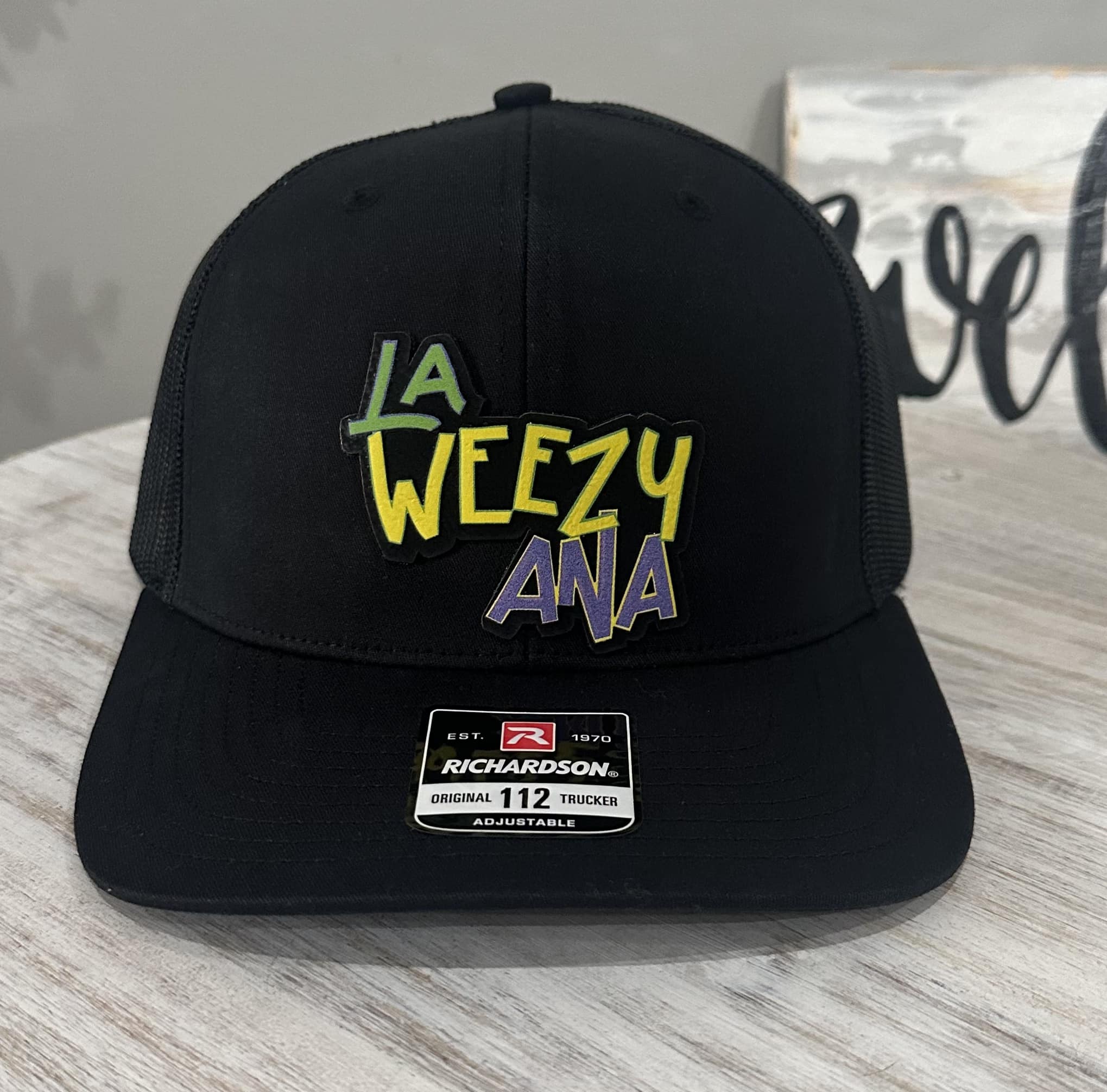 La Weezy Ana Purple Green Gold Leatherette Patch Hat - Black